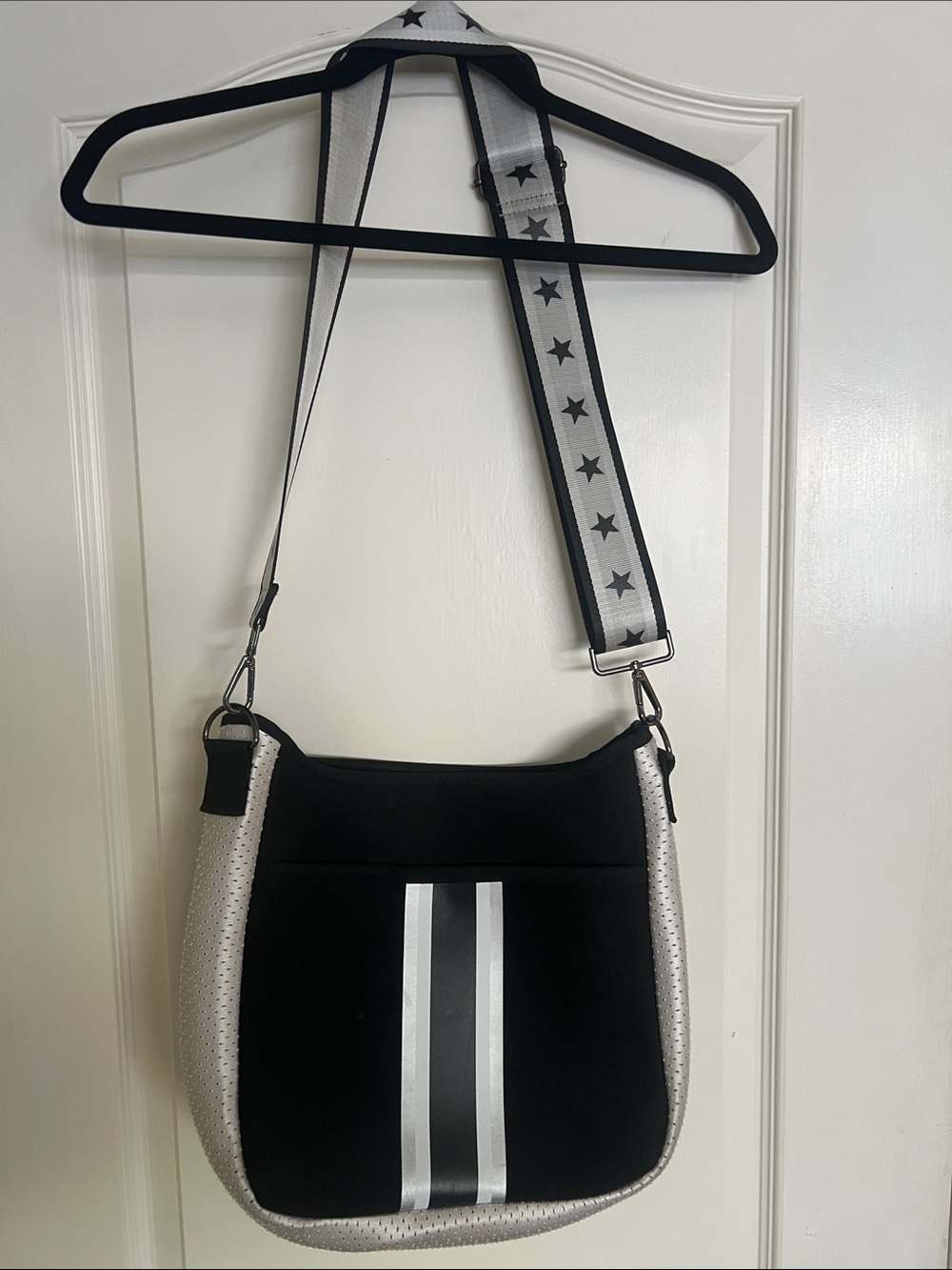 HAUTE SHORE Black and Silver Crossbody Bag with Star-Detail Strap